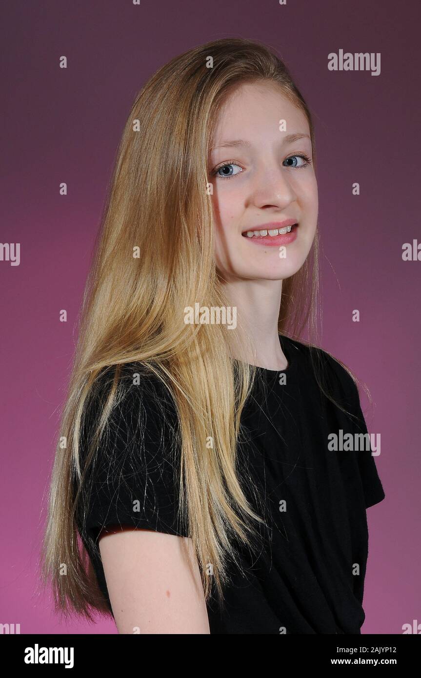Pretty Blonde Haired Caucasian Teenage Girl In A Black T Shirt