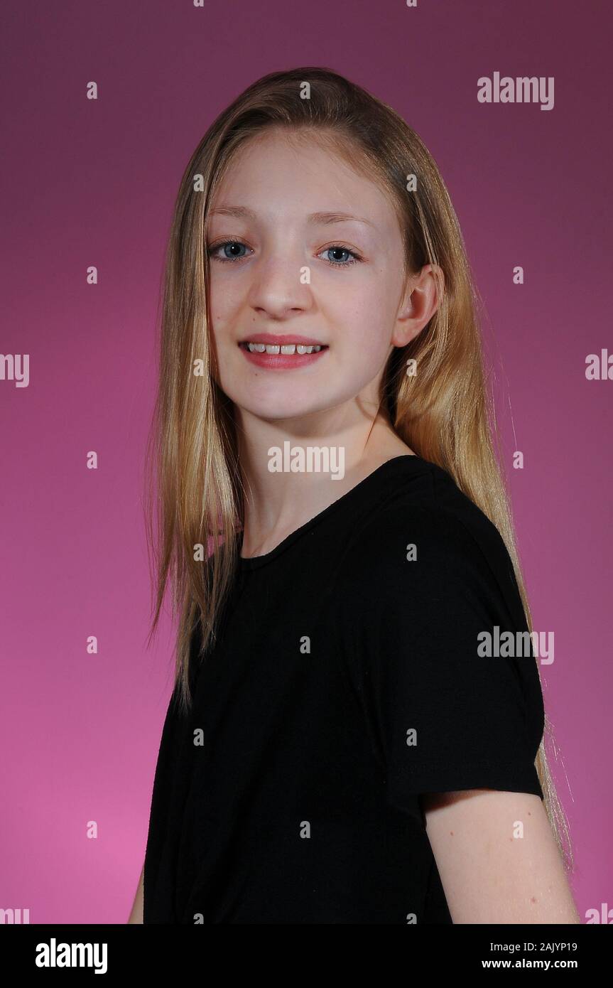 Pretty Blonde Haired Caucasian Teenage Girl In A Black T Shirt