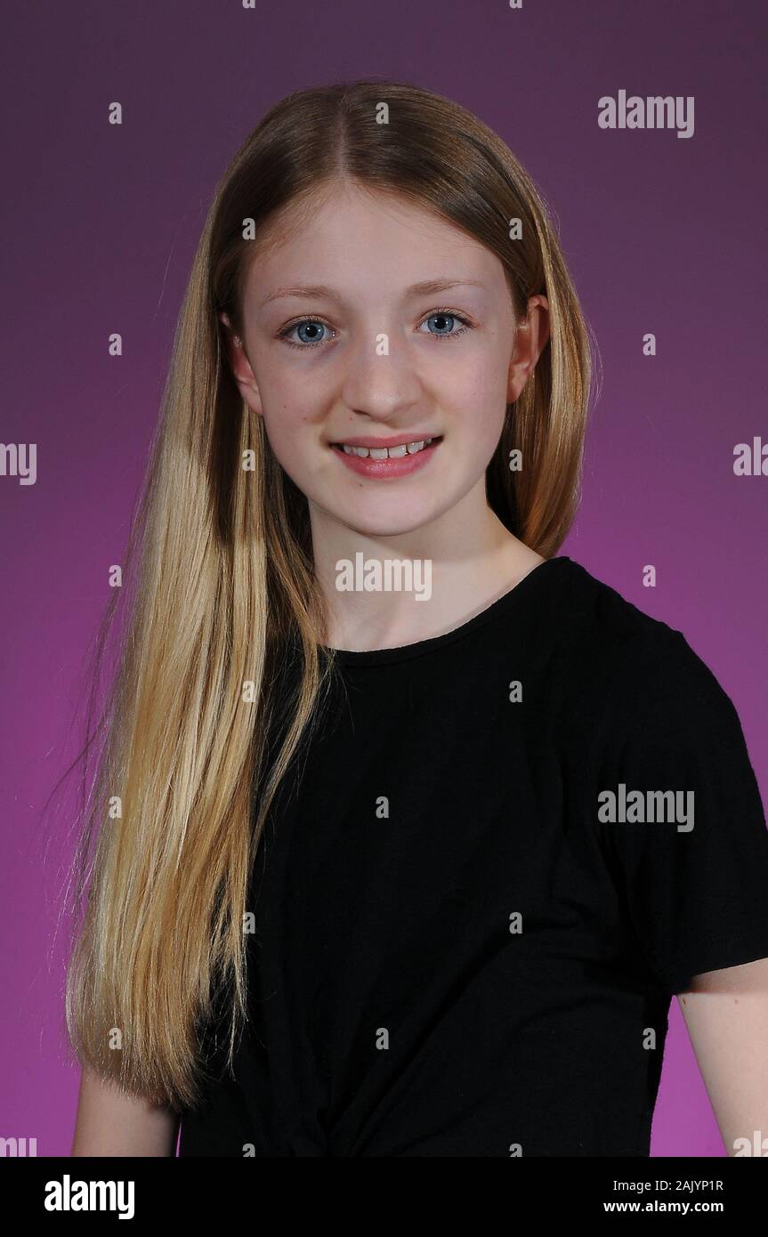 Pretty Blonde Haired Caucasian Teenage Girl In A Black T Shirt