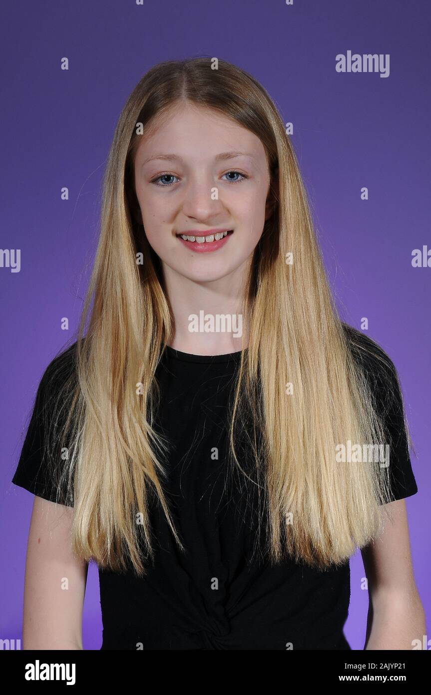 Pretty Blonde Haired Caucasian Teenage Girl In A Black T Shirt