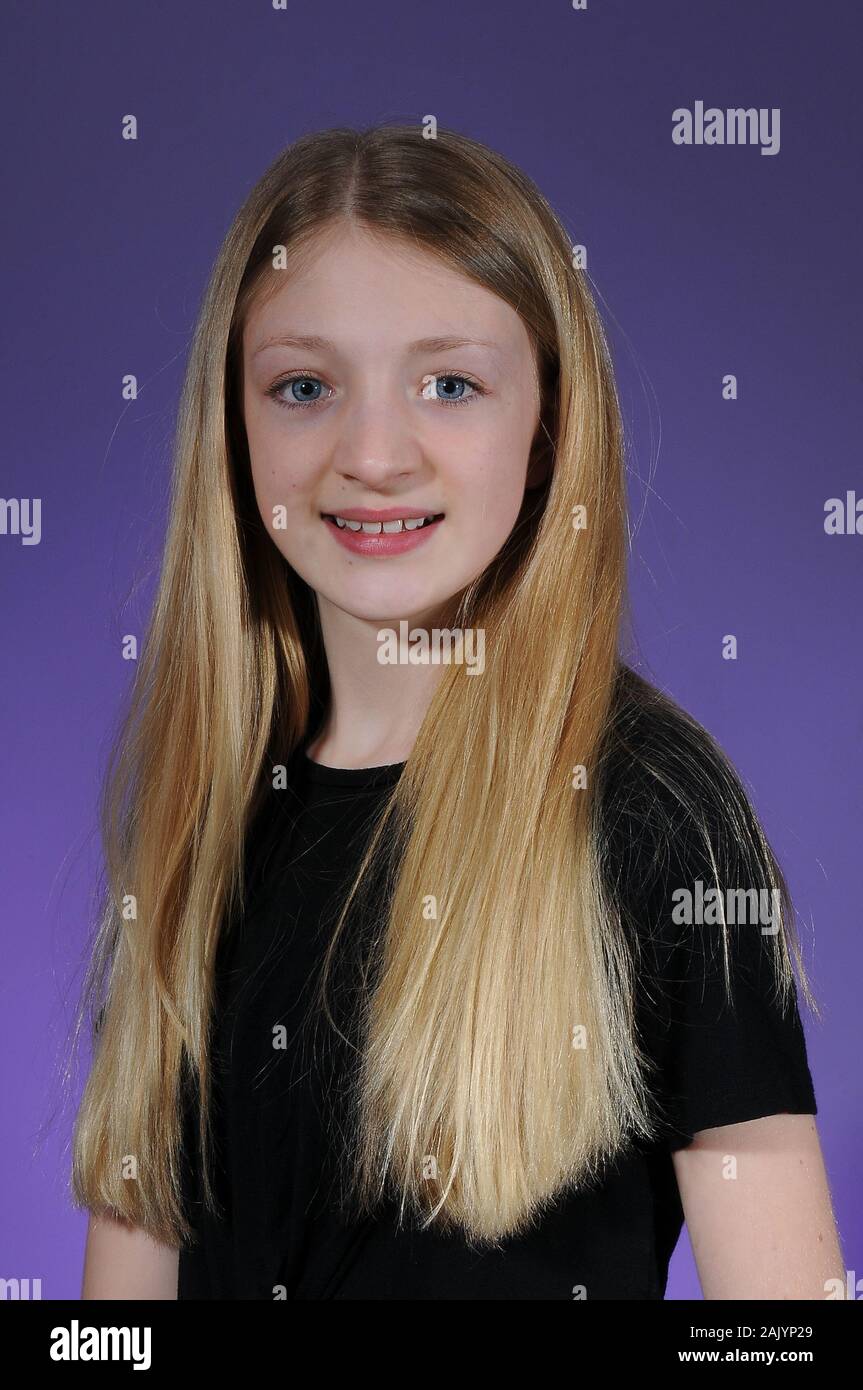 Pretty Blonde Haired Caucasian Teenage Girl In A Black T Shirt