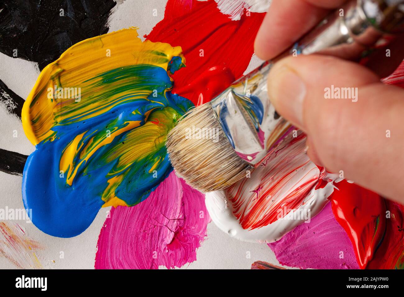 Hand picking up paint brush hi-res stock photography and images - Alamy