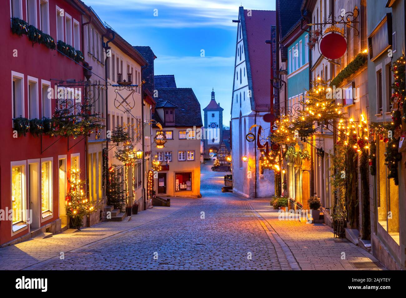 Decorated and illuminated Christmas street with gate and tower Plonlein in medieval Old Town of Rothenburg ob der Tauber, Bavaria, southern Germany Stock Photo