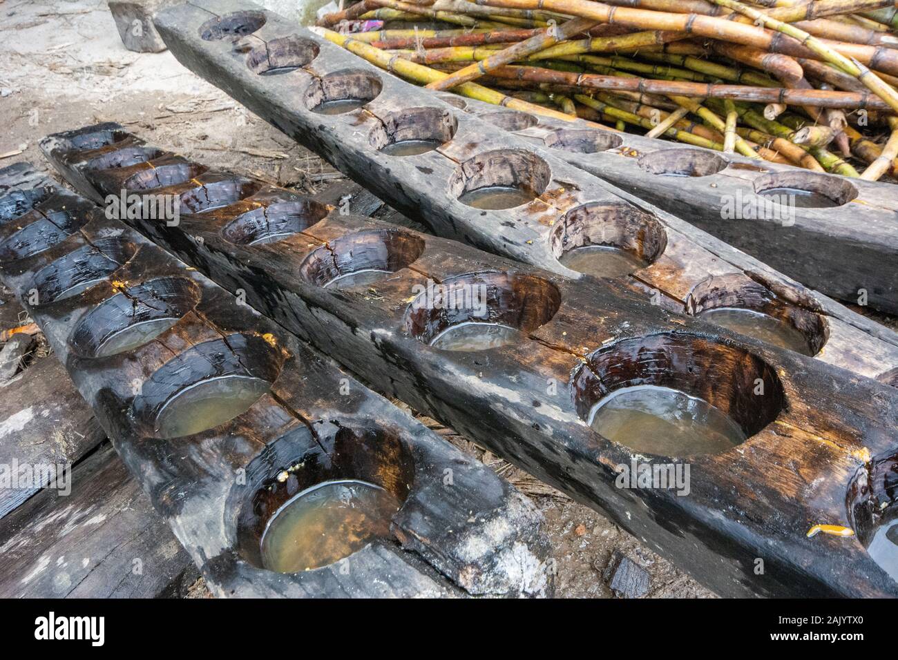 Wooden moulds and sugar cane for processing sugar into blocks in a traditional way in Amazonas in northern Peru Stock Photo