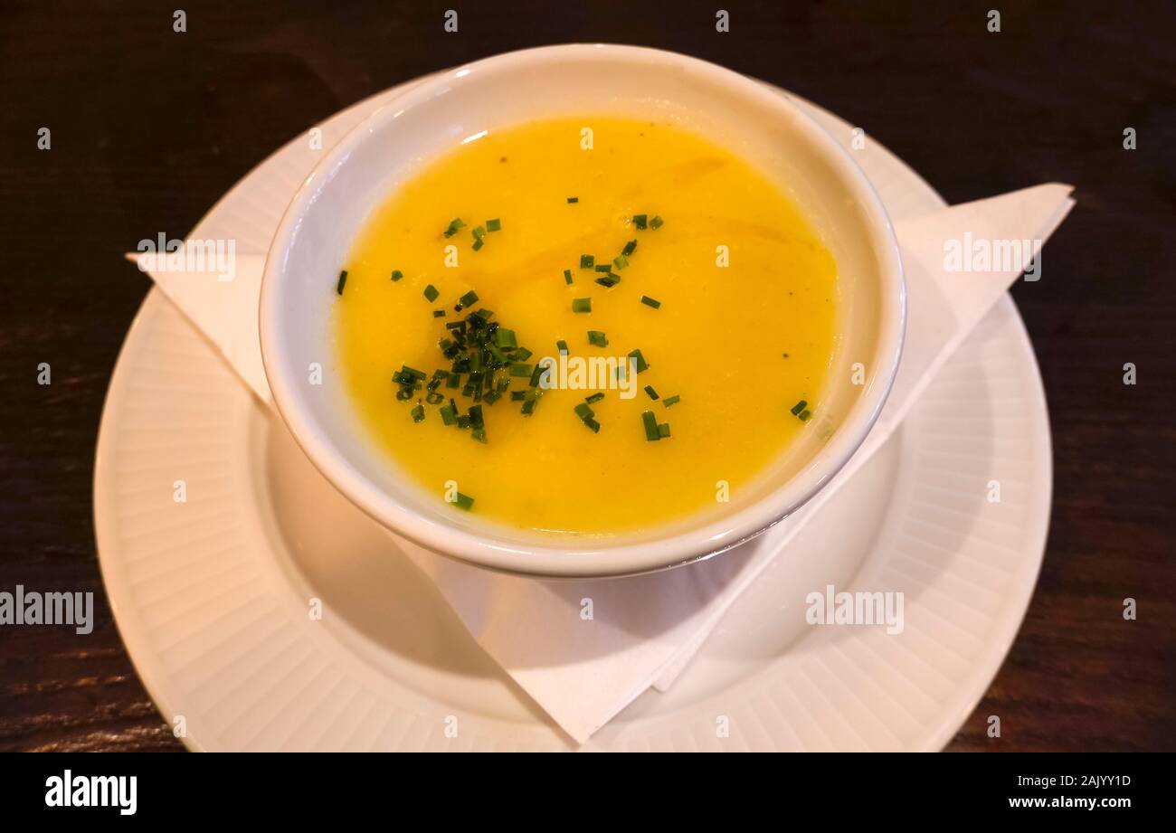 A creamy bowl of leek and potato soup with a sprinkling of chopped chives Stock Photo
