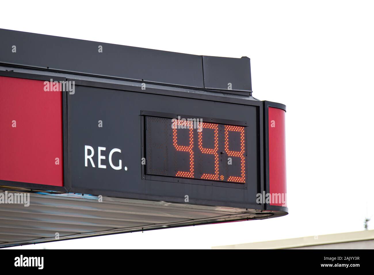 The Top of a Gas Station showing the price of regular gas cost Stock