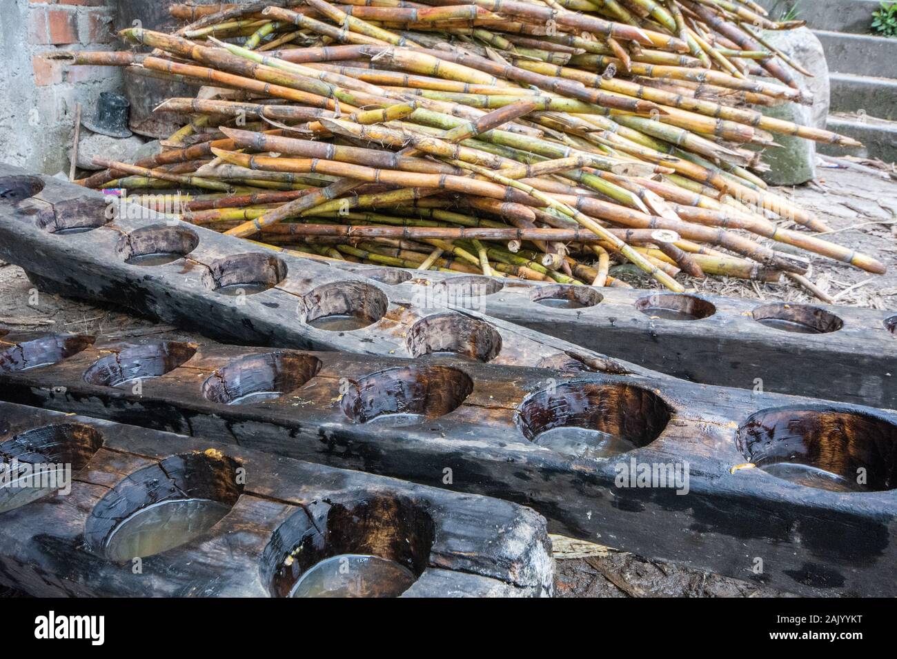 Wooden moulds and sugar cane for processing sugar into blocks in a traditional way in Amazonas in northern Peru Stock Photo