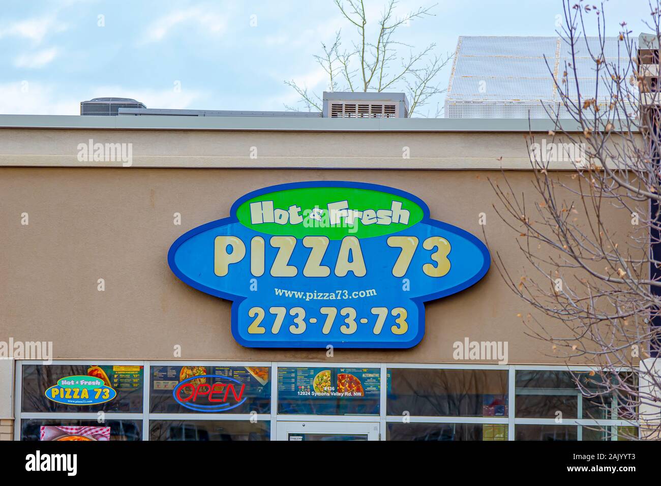Calgary, Alberta. Canada Jan 4 2020. A closeup of a Pizza 73 sign