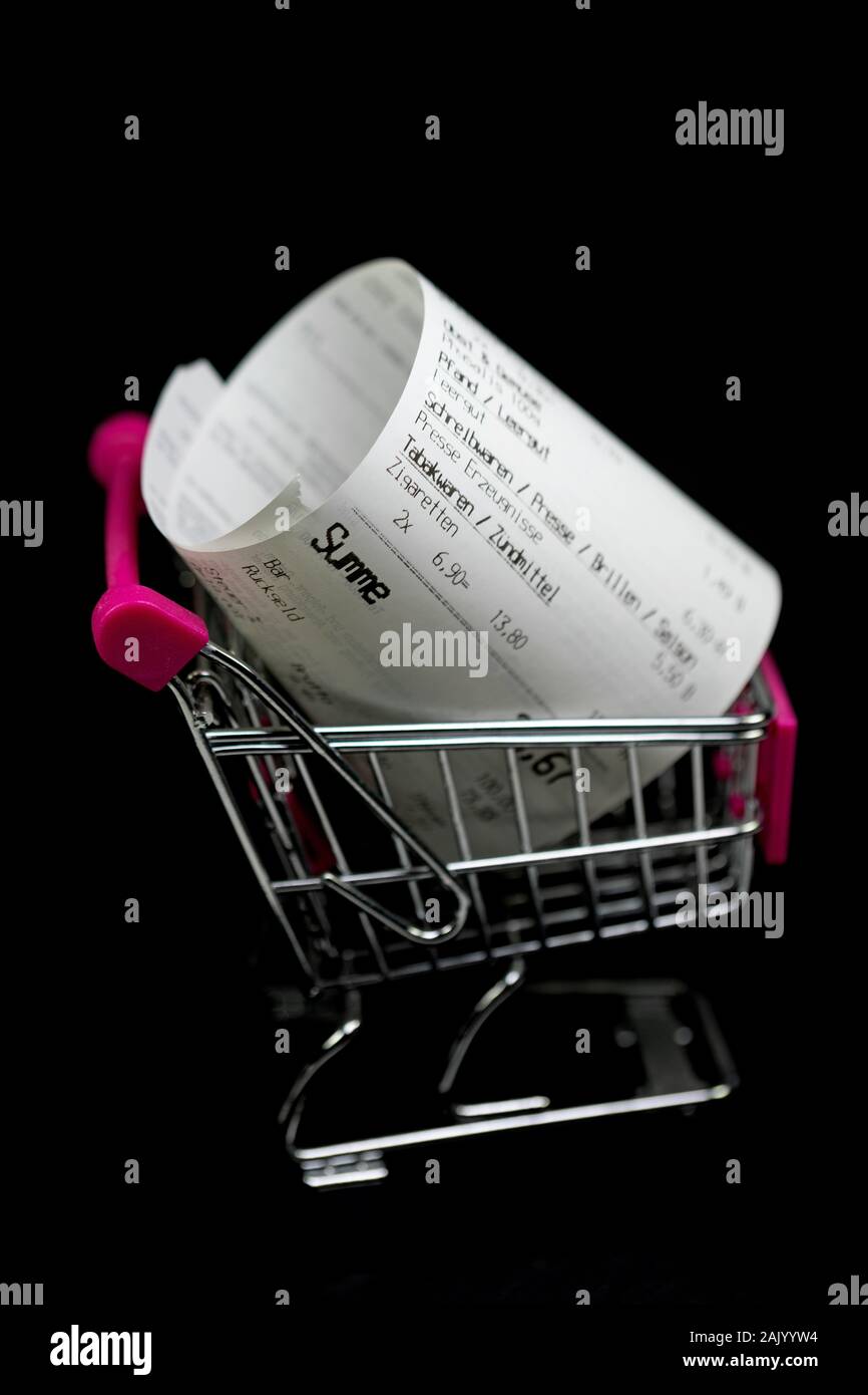 Sales slip with text 'sum' in shopping cart against black background Stock Photo