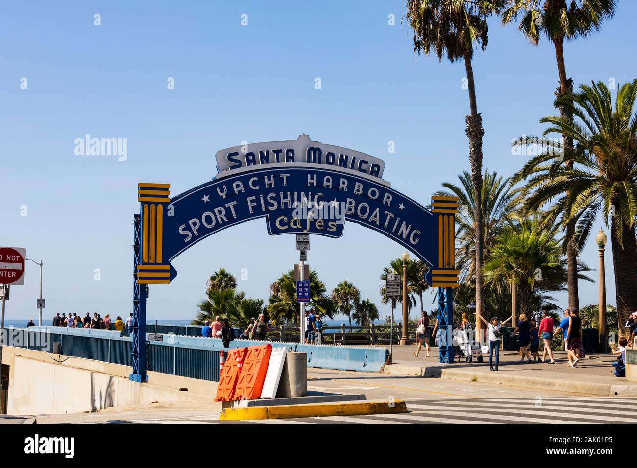Entrance sign and tourists at the Santa Monica pier, , Los Angeles, California, USA Stock Photo