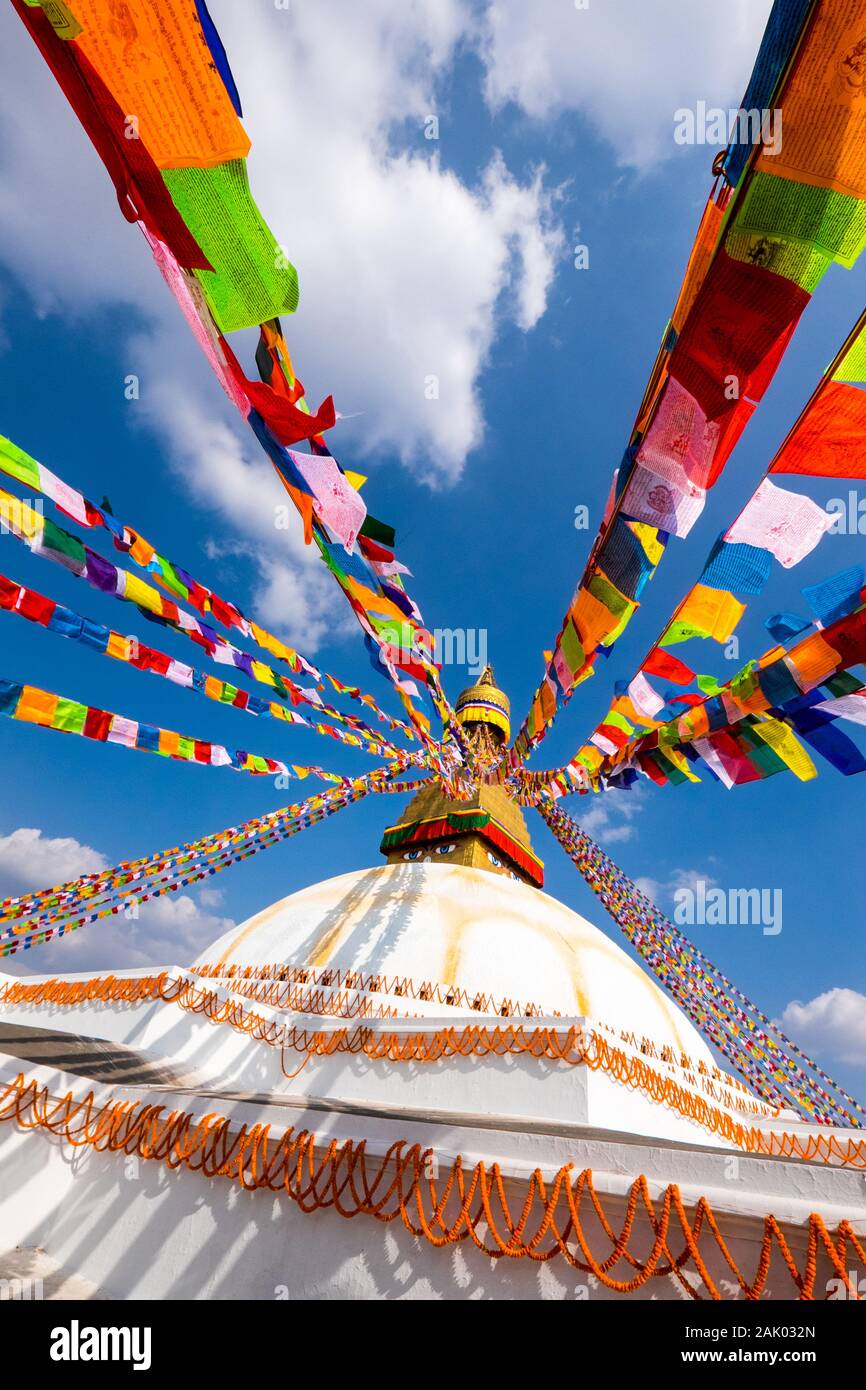 Prayer flags against a blue sky at Bodnath / Boudhanath Buddhist Stupa, Kathamandu, Nepal Stock Photo