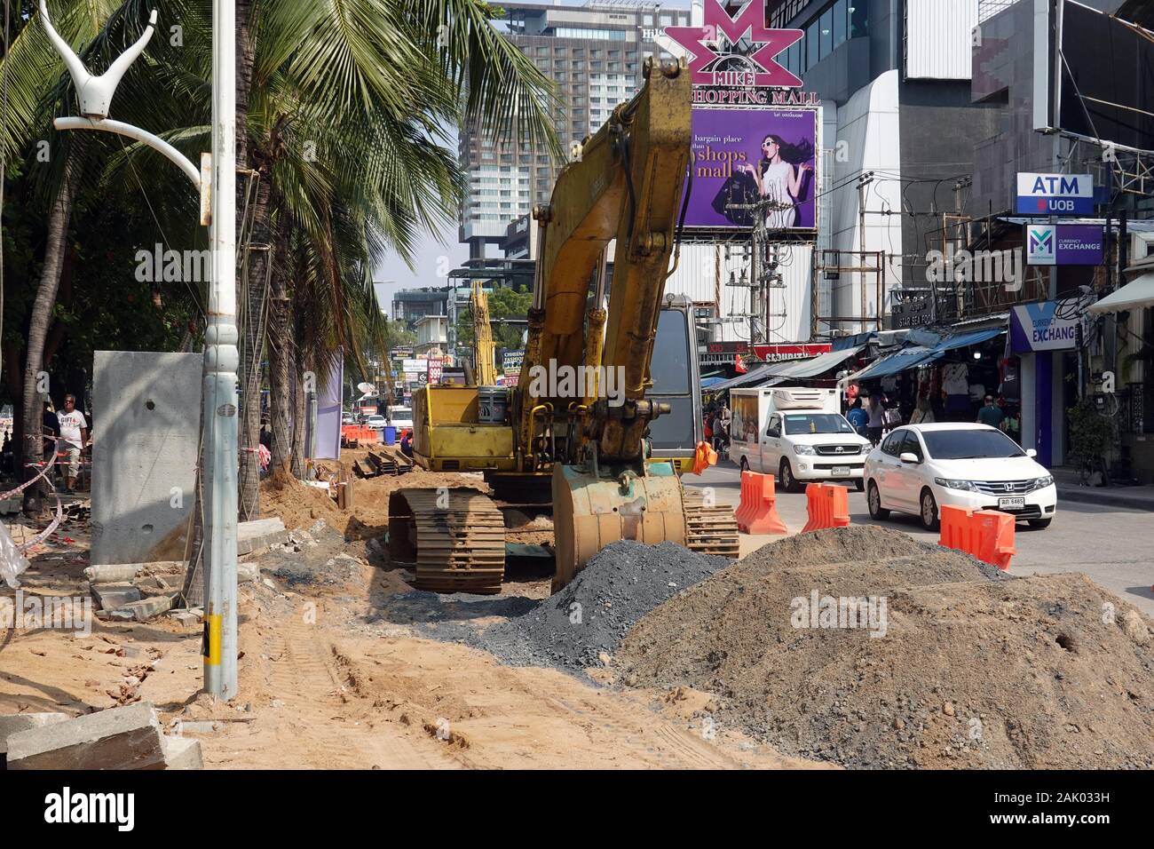 PATTAYA, THAILAND - December 24, 2019: Excavator on construction site on Beach Street. Stock Photo
