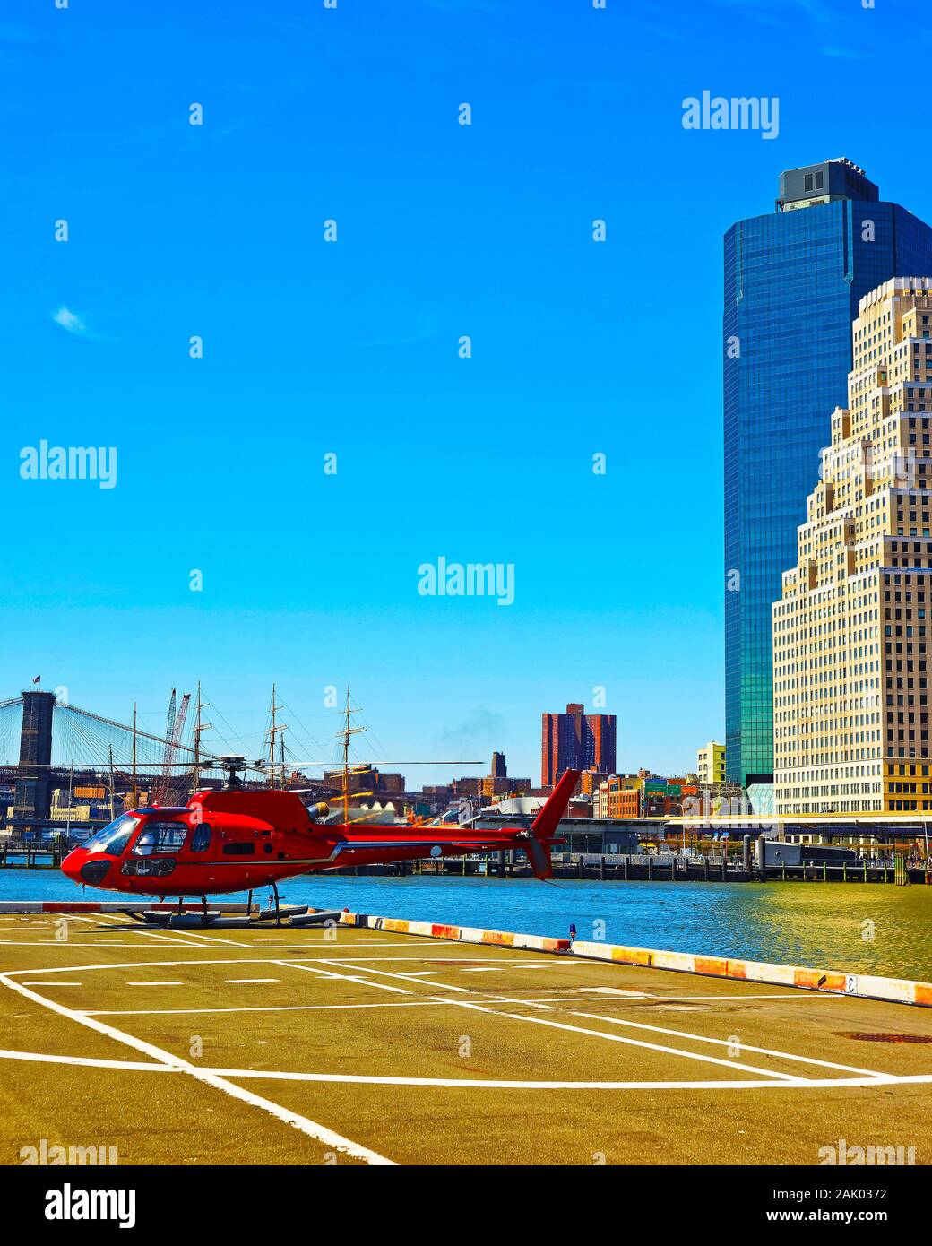 Red Helicopter landing on helipad in Lower Manhattan New York reflex
