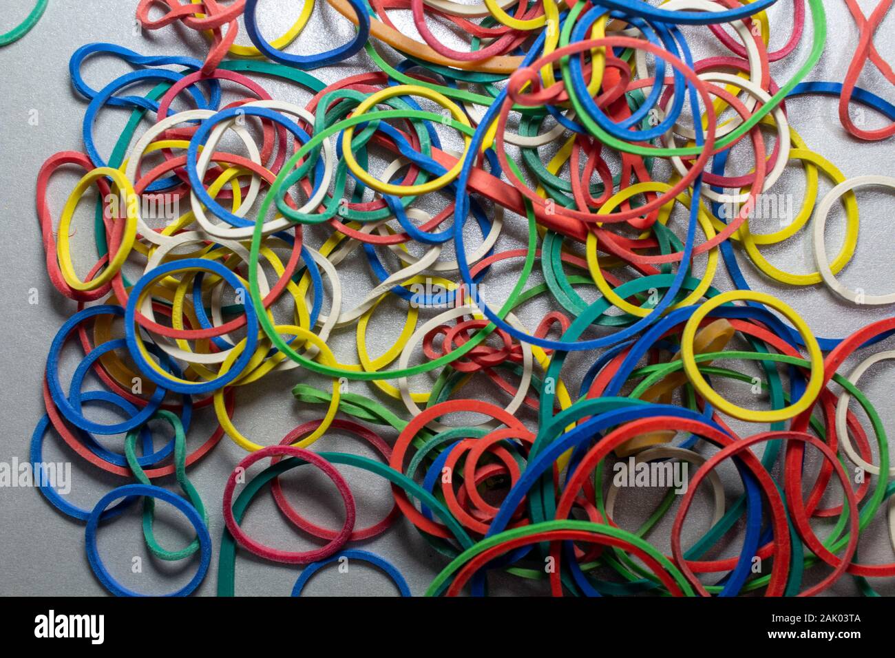 colored rubber bands on a table Stock Photo