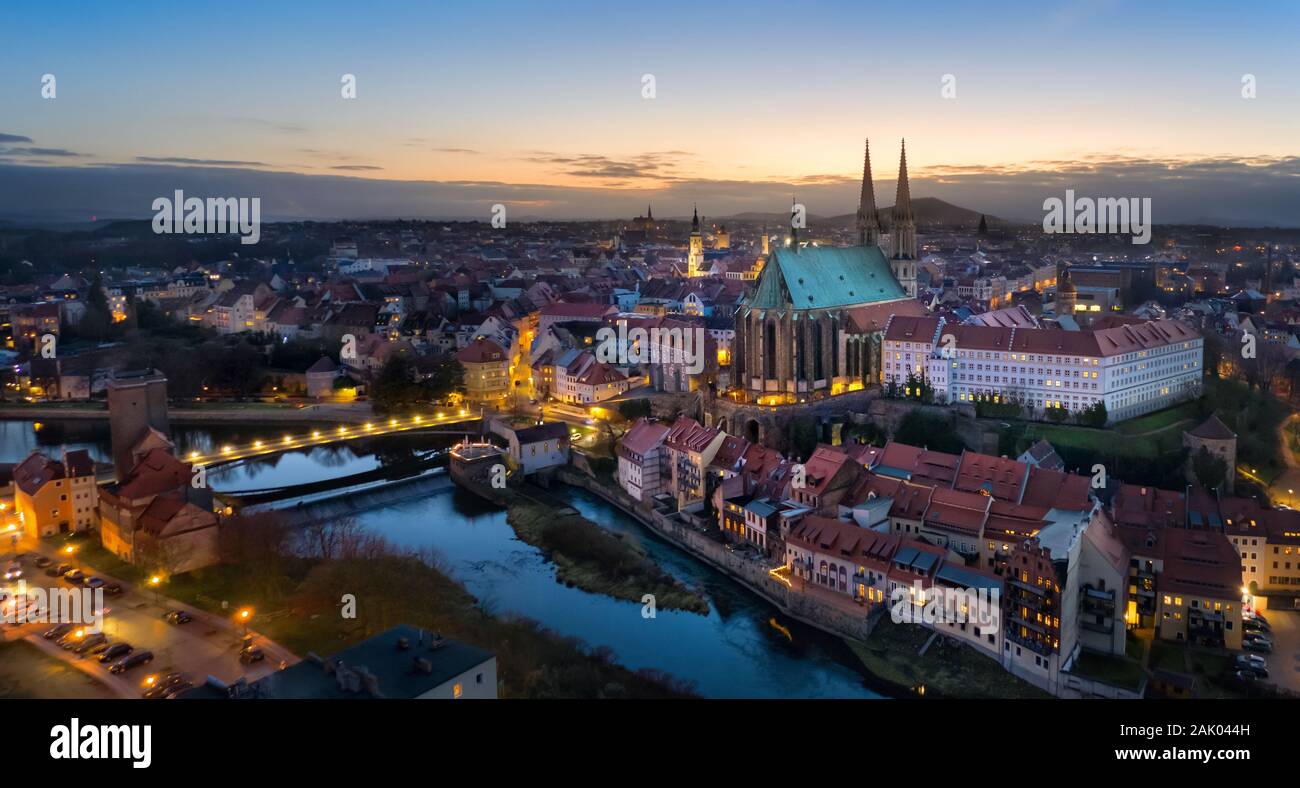 Gorlitz, Germany. Panoramic aerial view of old town at dusk with gothic Sts. Peter and Paul Church Stock Photo