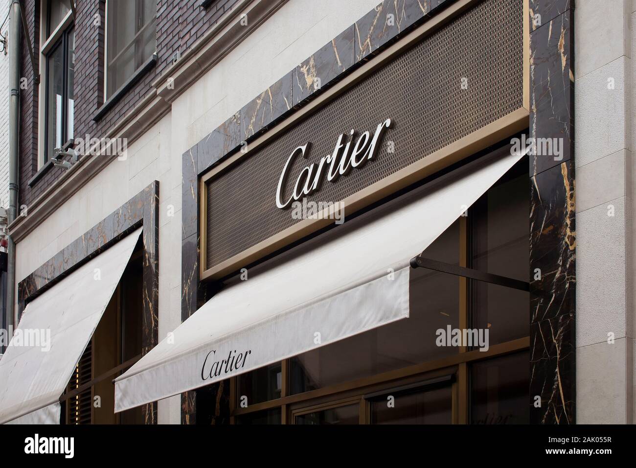 View of signage of French jewellery and watch manufacturer's store on on luxury shopping street named 'Pieter Corneliszoon Hooft' in Amsterdam. It is Stock Photo