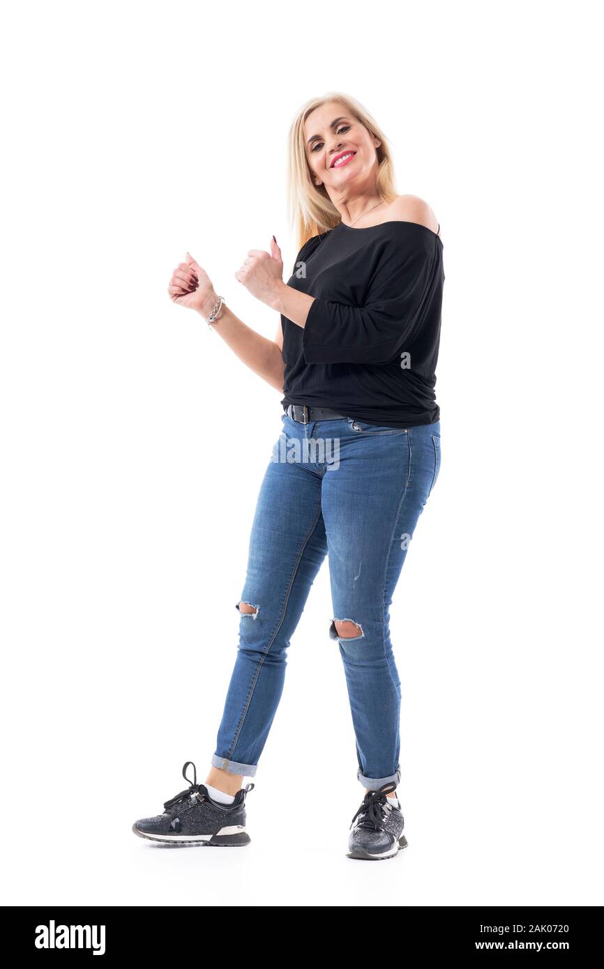 Happy healthy middle aged blond attractive woman in casual clothes smiling and showing thumbs up. Full body length isolated on white background. Stock Photo