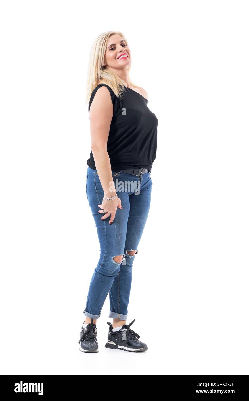 Confident blonde hair middle aged modern woman in casual clothes smiling at camera. Full body length isolated on white background. Stock Photo