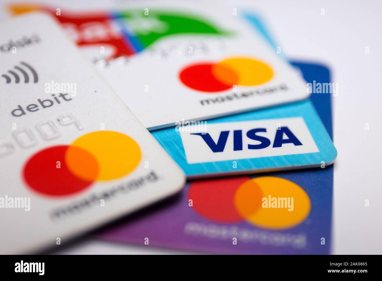 In this photo illustration a Visa credit card and Mastercard debit ...