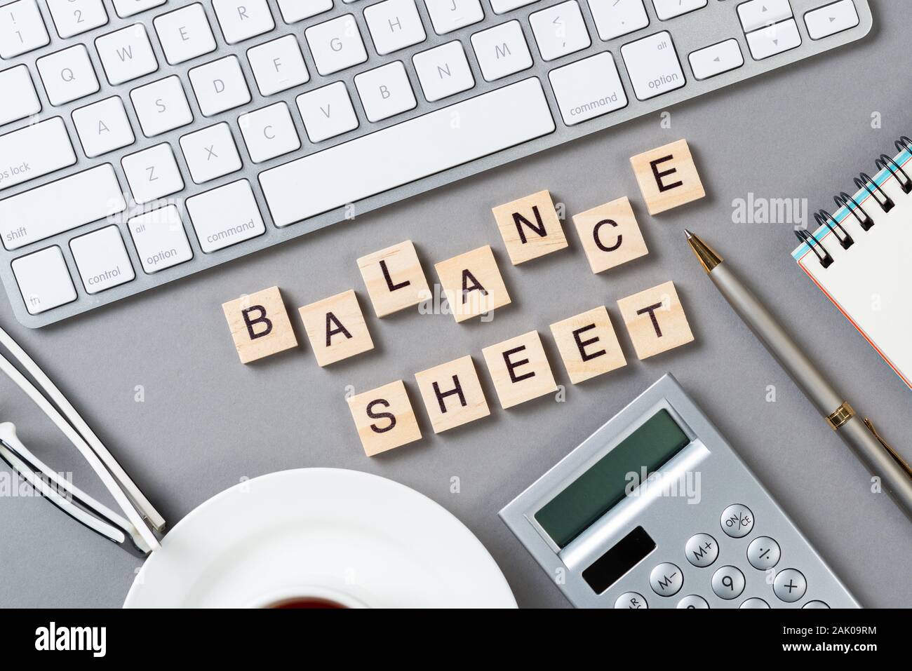 Balance sheet concept with letters on cubes Stock Photo Alamy