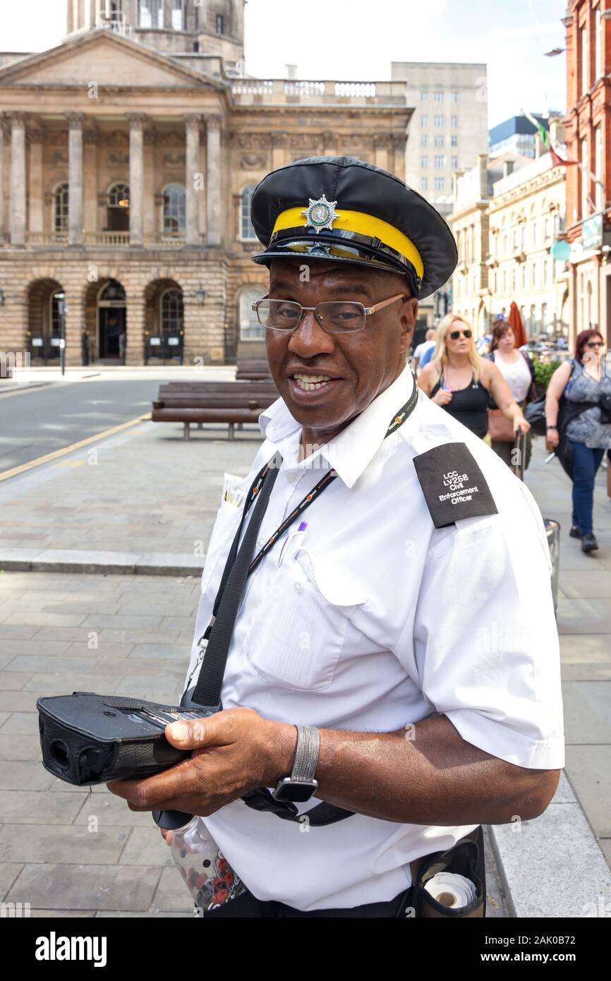 Traffic enforcement officer holding terminal, High Street, Liverpool, Merseyside, England, United Kingdom Stock Photo