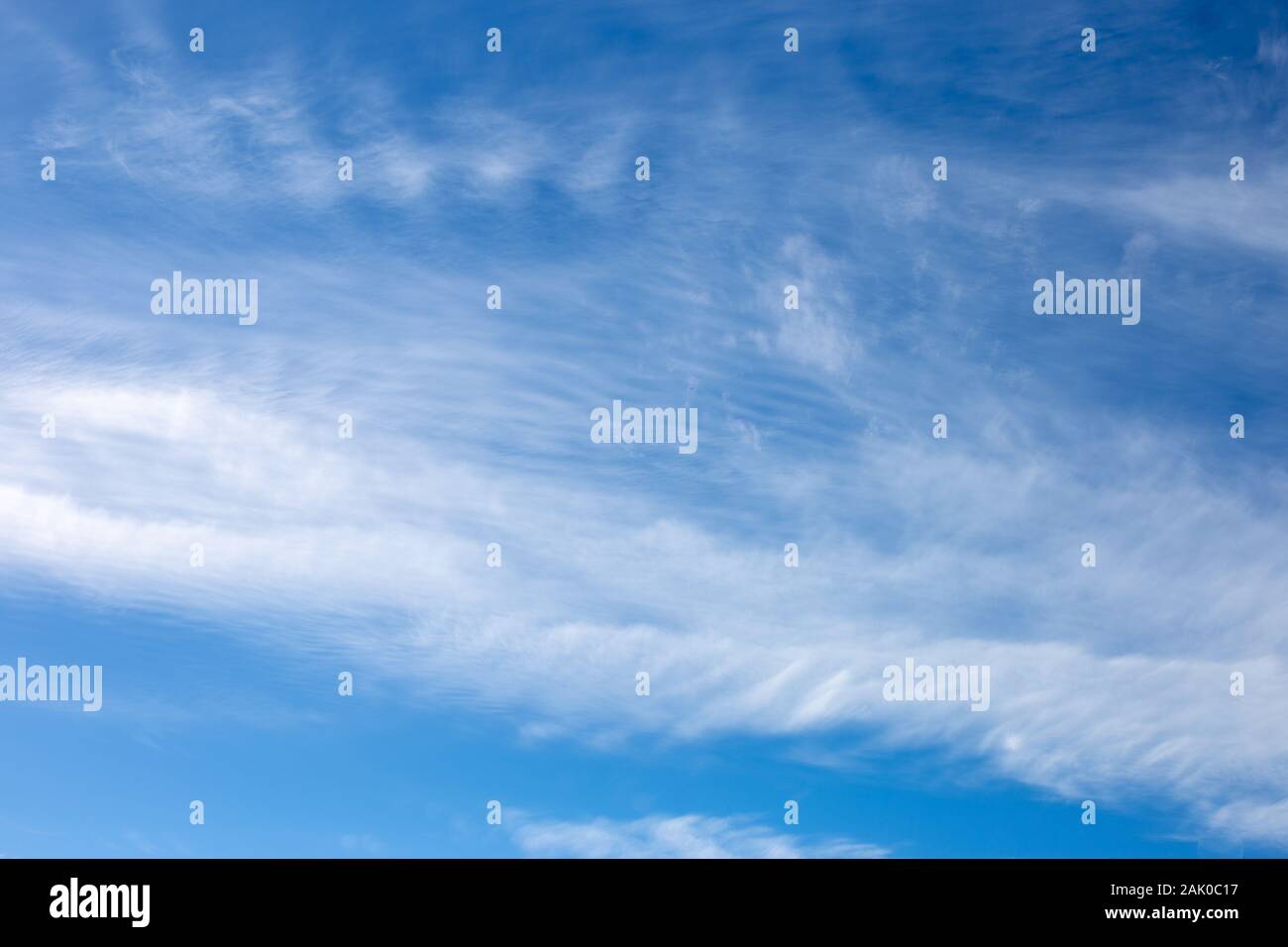Blurred white clouds on the sky background. Stock Photo