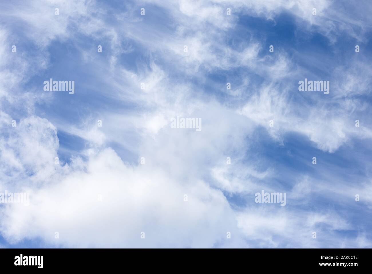 Blurred white clouds on the sky background. Stock Photo