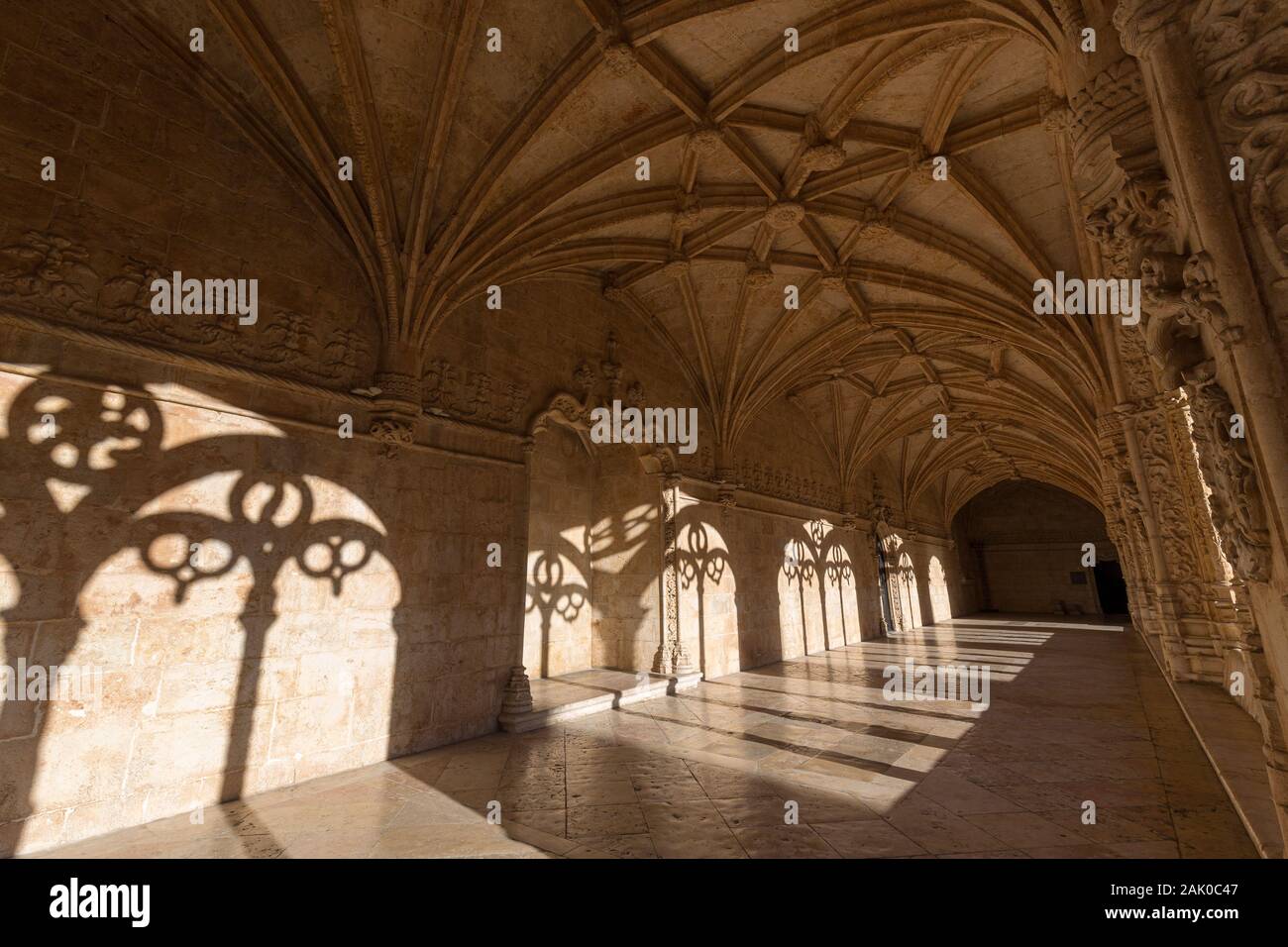 Ornamental and empty cloister at the historic Manueline style Mosteiro dos Jeronimos (Jeronimos Monastery) in Belem, Lisbon, Portugal, on a sunny day. Stock Photo