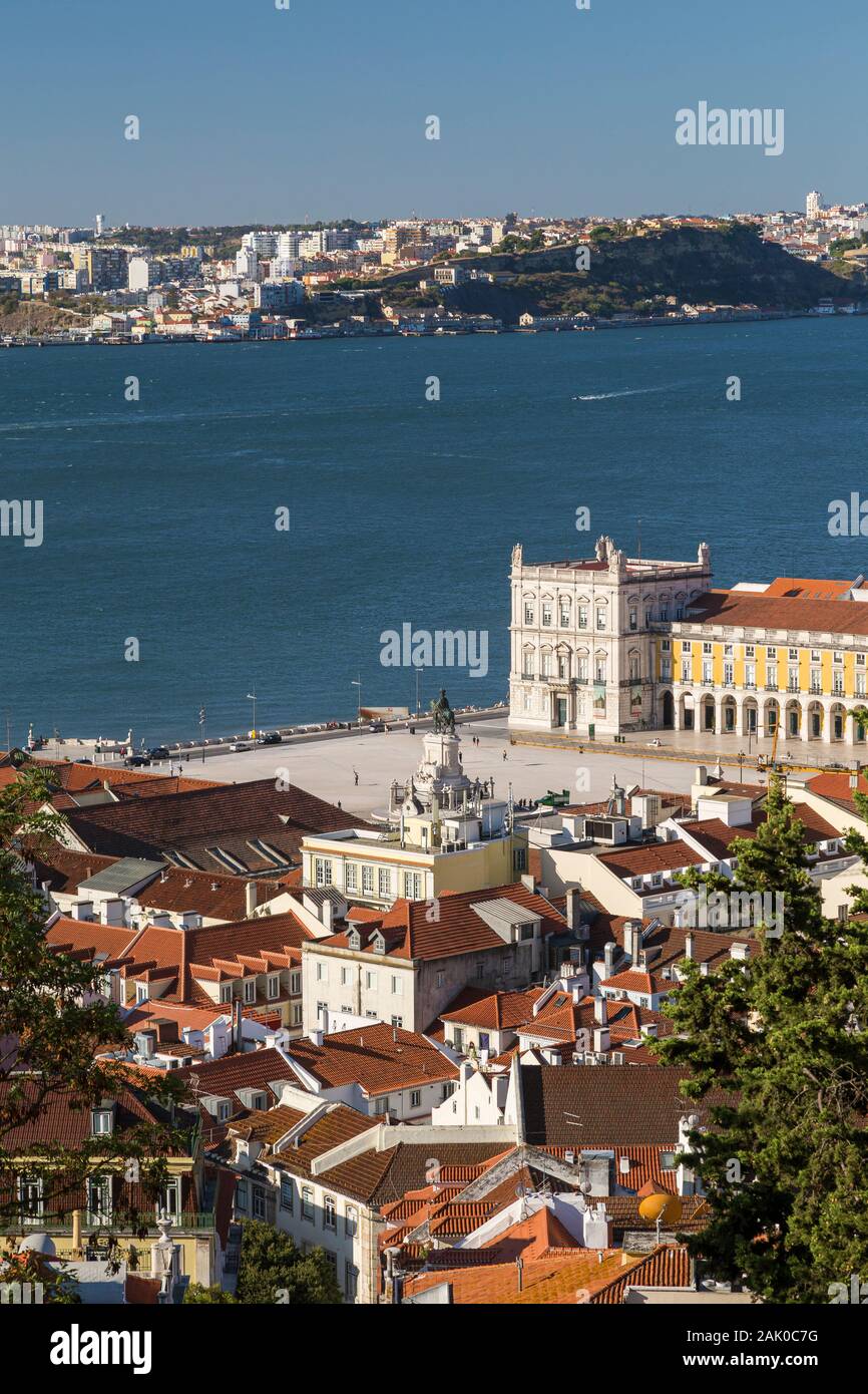 View of the historical Praca do Comercio and Alfama district in downtown Lisbon, Tagus River and Almada city from above in Portugal. Stock Photo