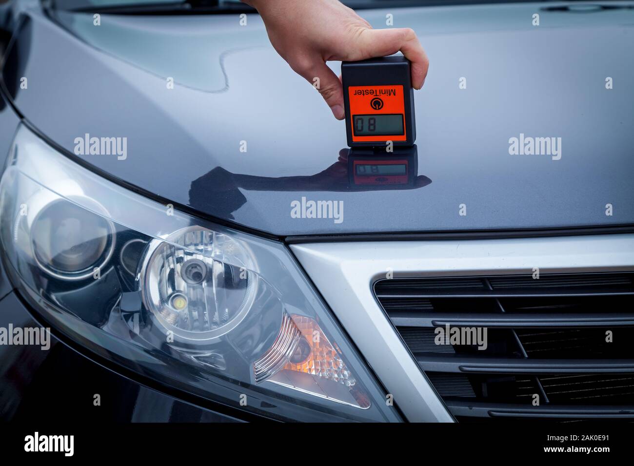 Measuring the thickness of the car paint coating in black color using a