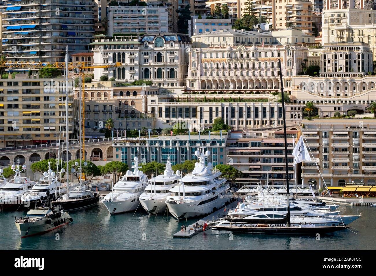 Apartment buildings, luxury yachts and sailing boats in Port Hercules harbour, La Condamine, Principality of Monaco, French Riviera, Europe Stock Photo