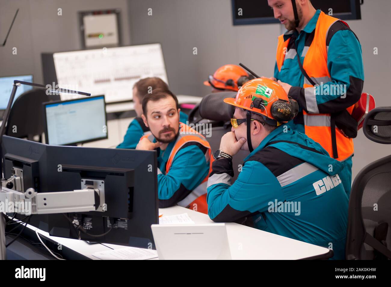 Men In Control Men in control room of polypropylene factory Stock Photo - Alamy
