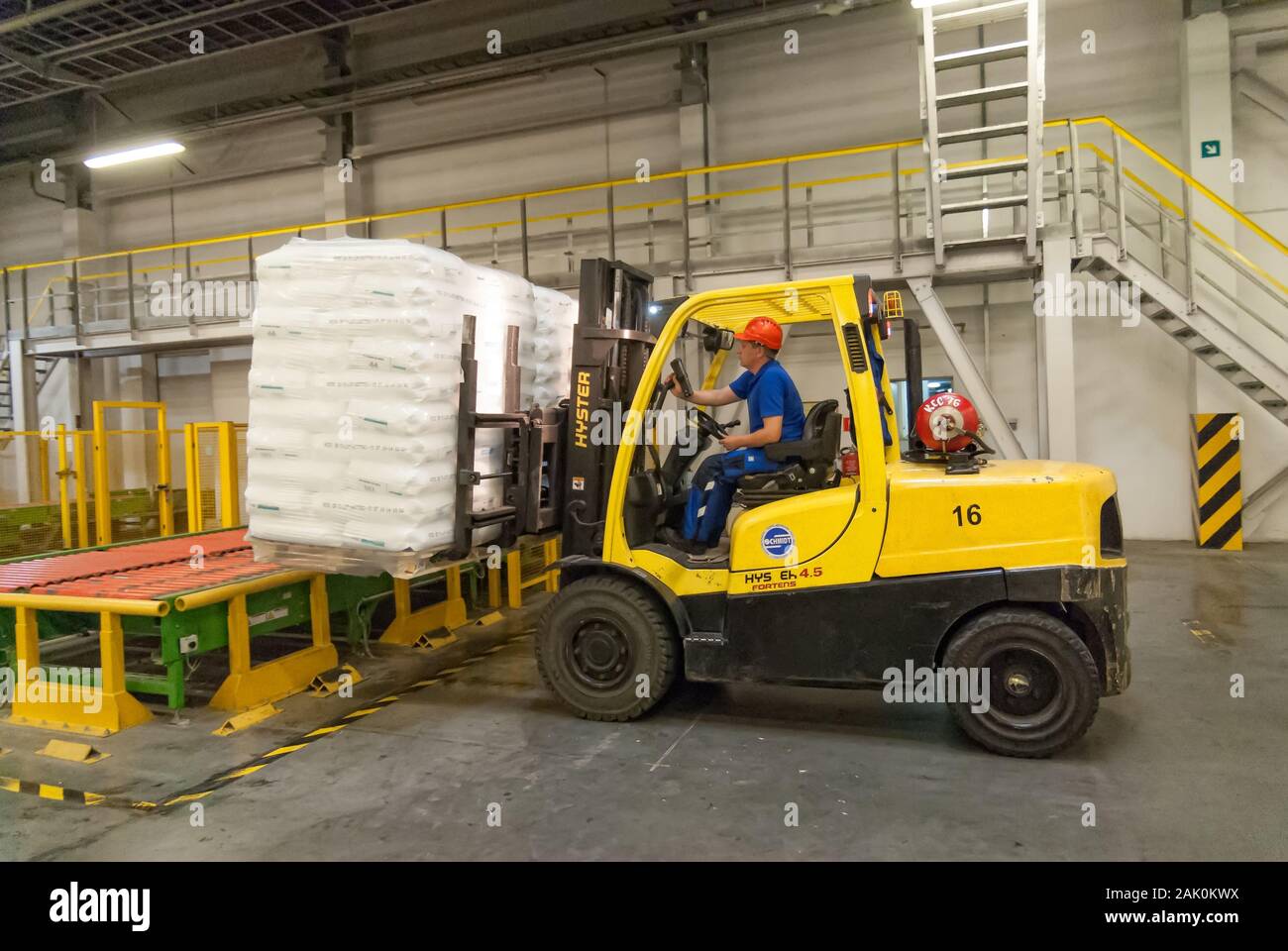 Forklift truck loads pallets with finished goods Stock Photo Alamy