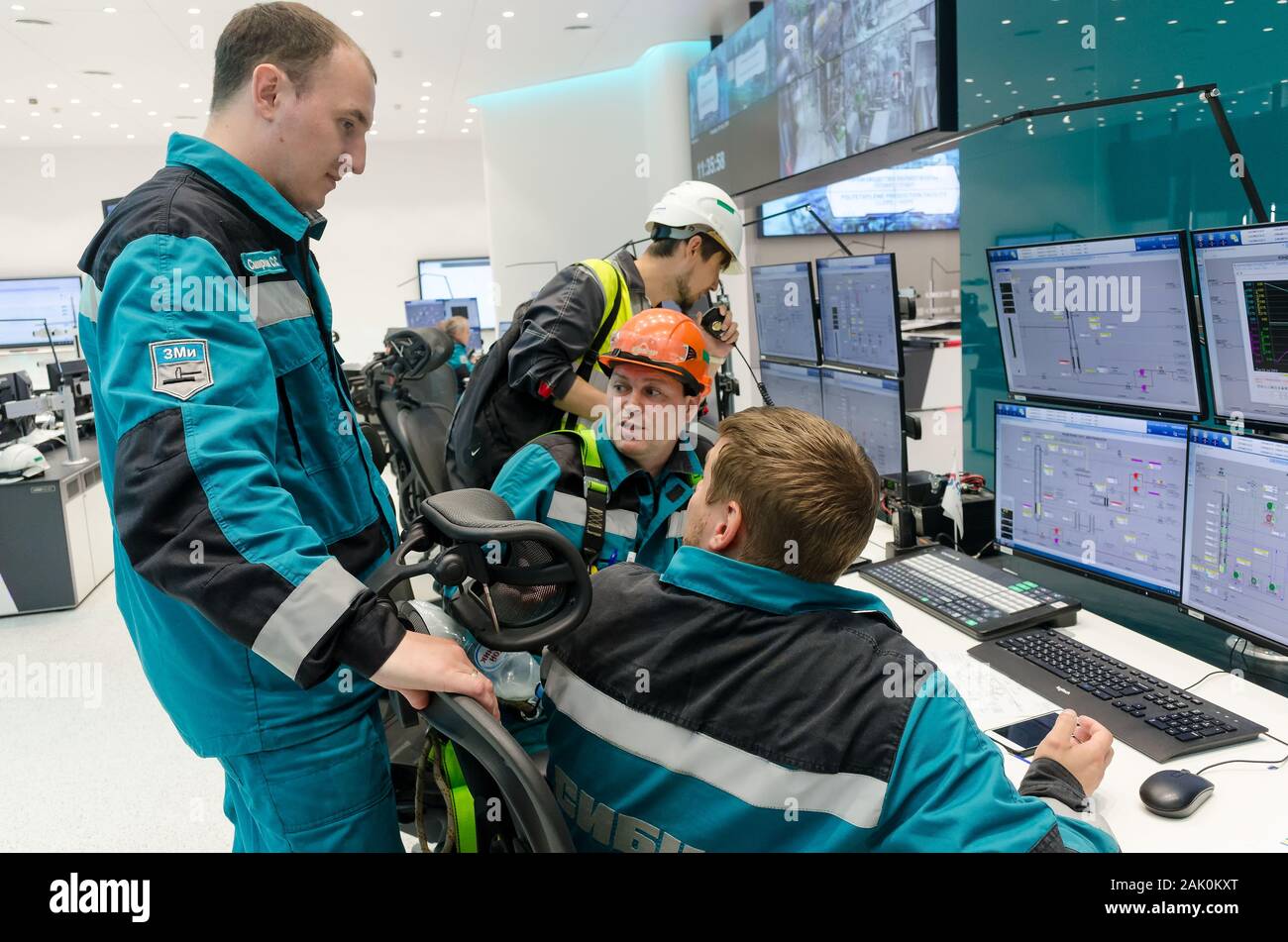 Men In Control Men in control room of polypropylene factory Stock Photo - Alamy