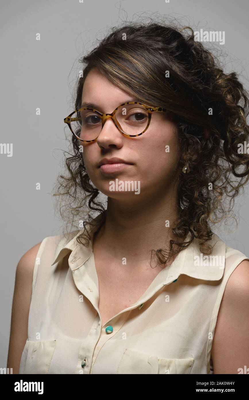 Portrait of young latino woman with eyeglasses Stock Photo