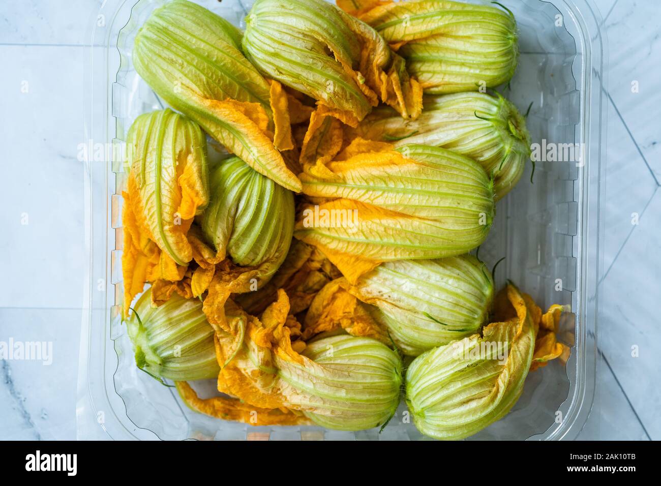 Squash Blossoms Zucchini Flowers In Plate Edible Courgette Flowers In Plastic Box Package Container Organic Food Stock Photo Alamy