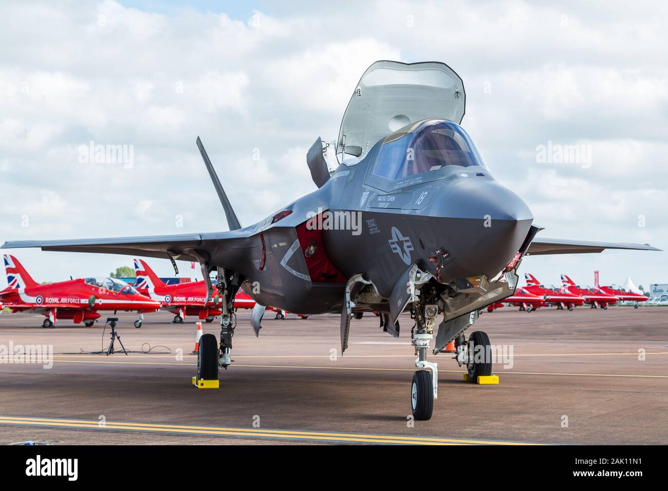 F-35B stealth fighter in front of the Red Arrows in July 2016 seen at the Royal International Air Tattoo, Gloucestershire in England. Stock Photo