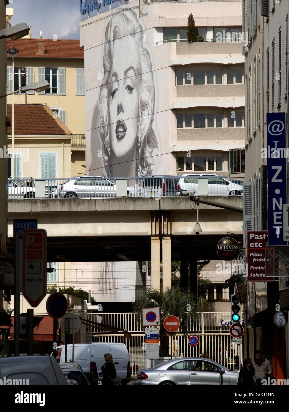 CANNES FRANCE - STREET VIEW NEAR CANNES TRAIN STATION WITH A LARGE WALL FRESCO OF MARYLIN MONROE ON A BUILDING FACADE - CANNES STREET - CANNES STREET ART © Frédéric BEAUMONT Stock Photo
