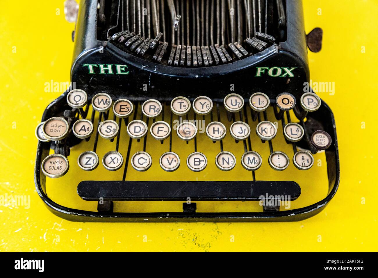 The Fox vintage typewriter on yellow background Stock Photo