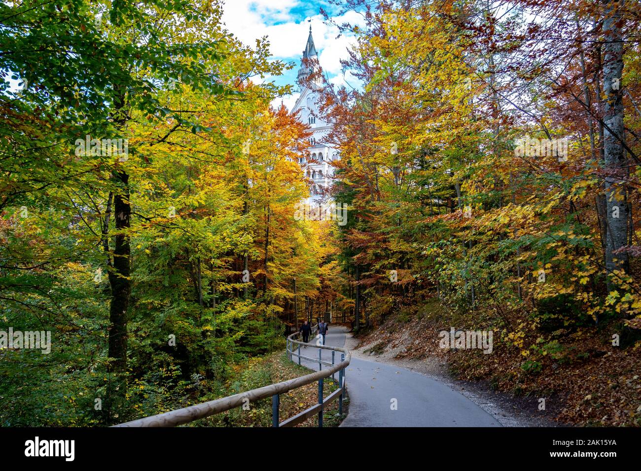 Schwangau, Germany - Neuschwanstein Castle peaking through the autumn leaves Stock Photo