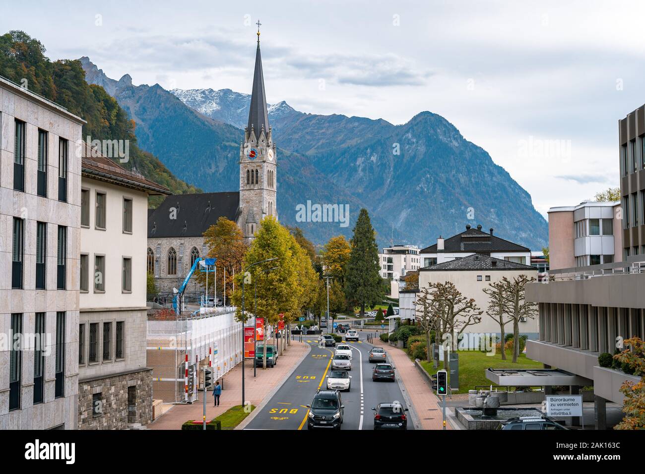 Vaduz, Liechtenstein - Main city street with St. Florin Cathedral in the background Stock Photo