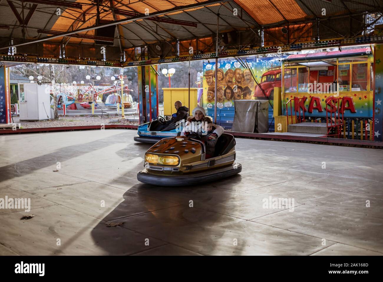 Belgrade, Serbia, Jan 5, 2020: Mother and son riding dodgem car at a funfair Stock Photo