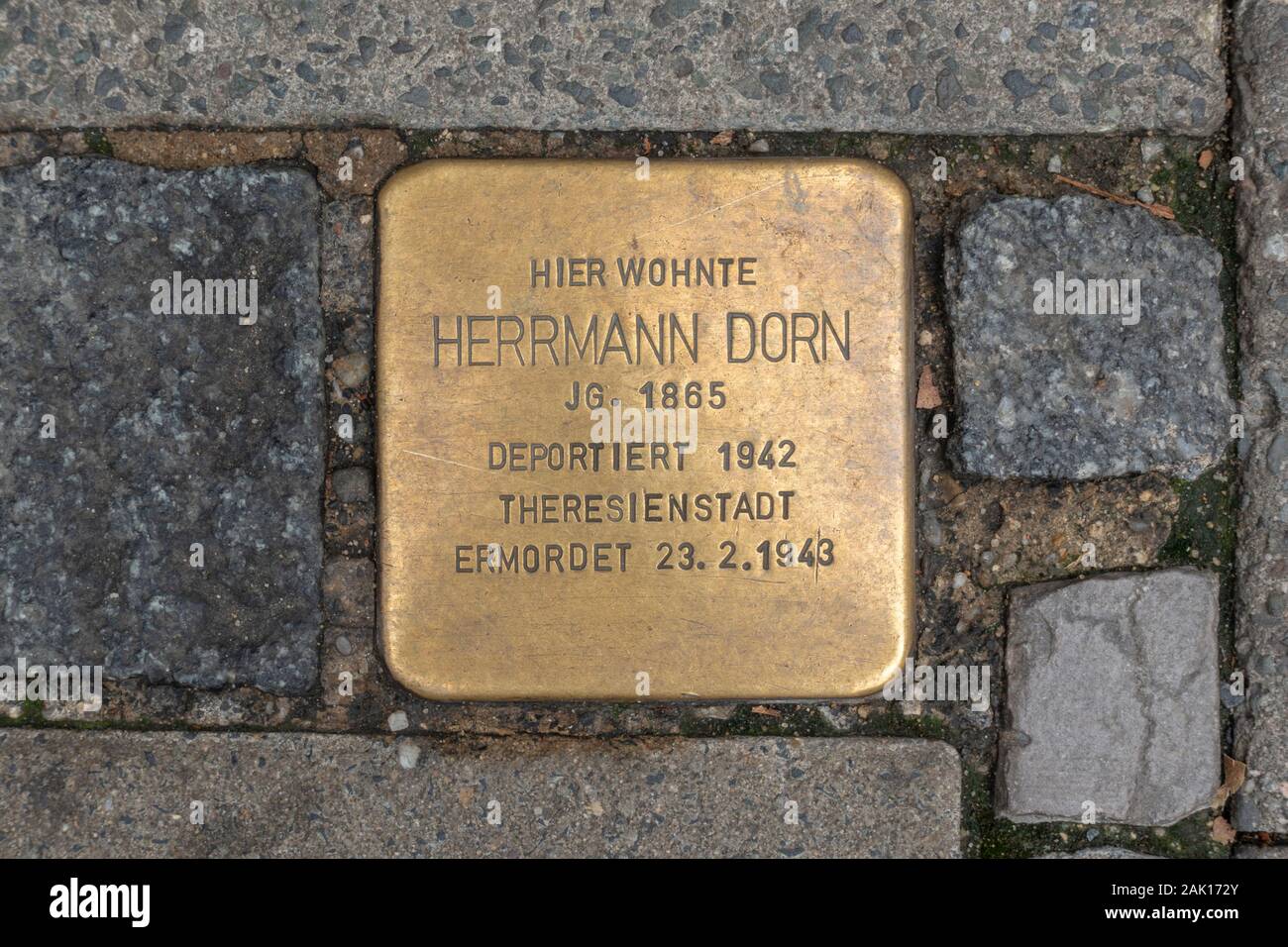 'Stumbling stones' Holocaust memorial markers for Herrmann Dorn in Coburg, Bavaria, Germany. Stock Photo