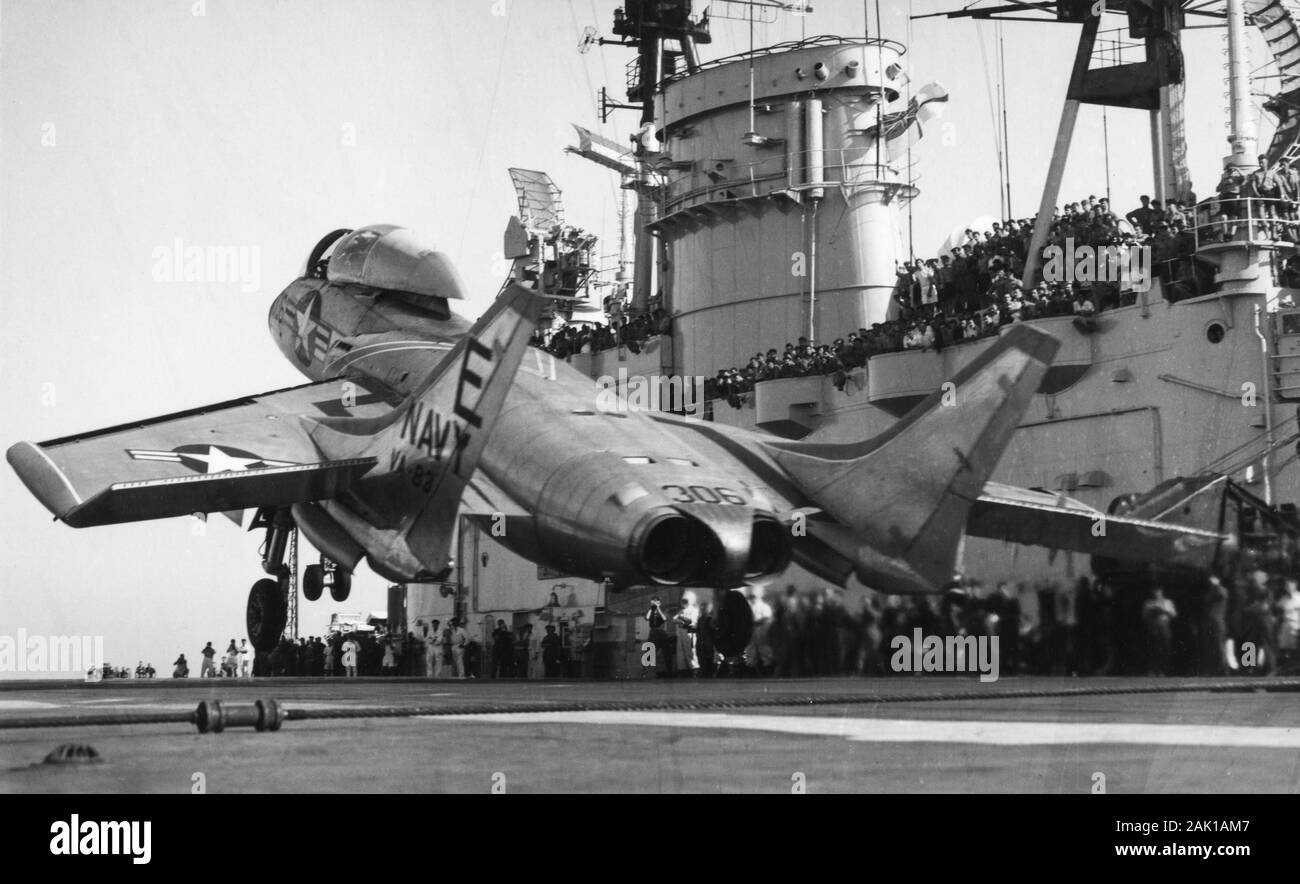 HMS Eagle in the 1950s conducting touch and go landings with a US Navy Cutlass fighter from VA-83 embarked on USS Intrepid Stock Photo