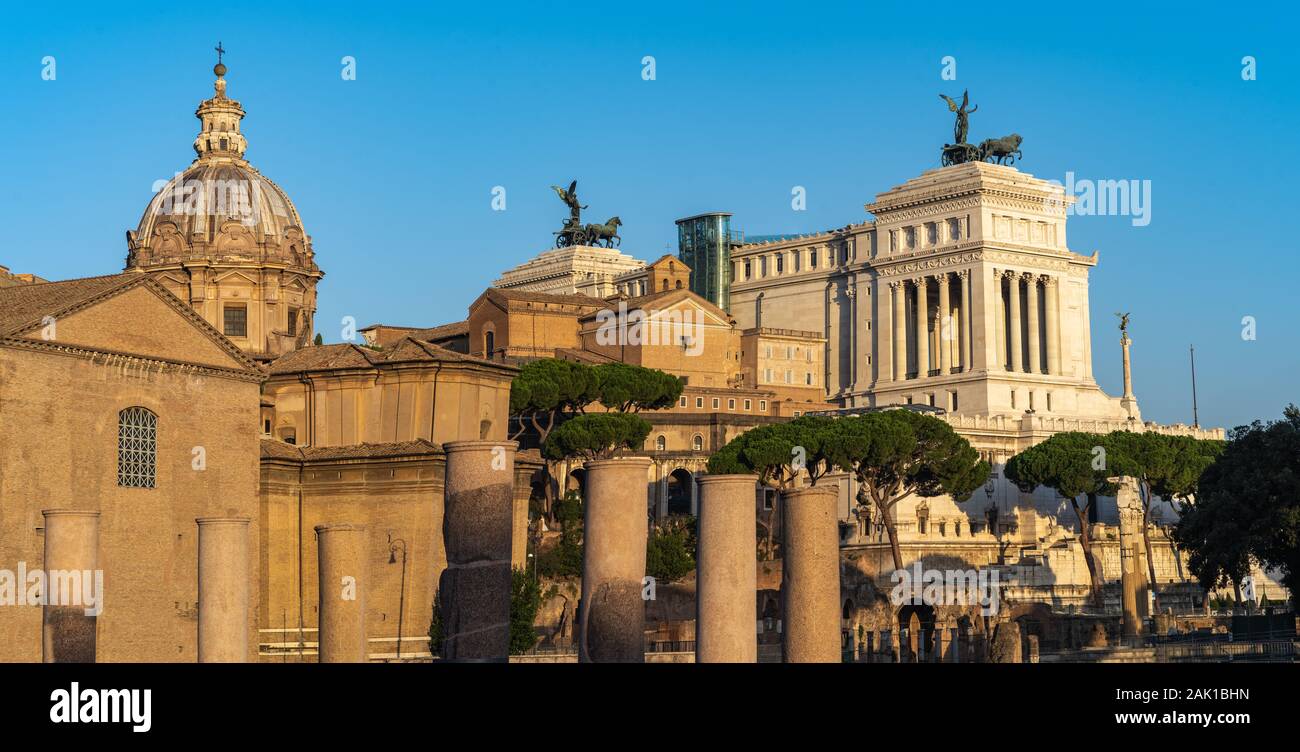 Beautiful travel photo of Rome - dome of basilica and Victor Emmanuel II National Monument during nice sunny weather. Stock Photo