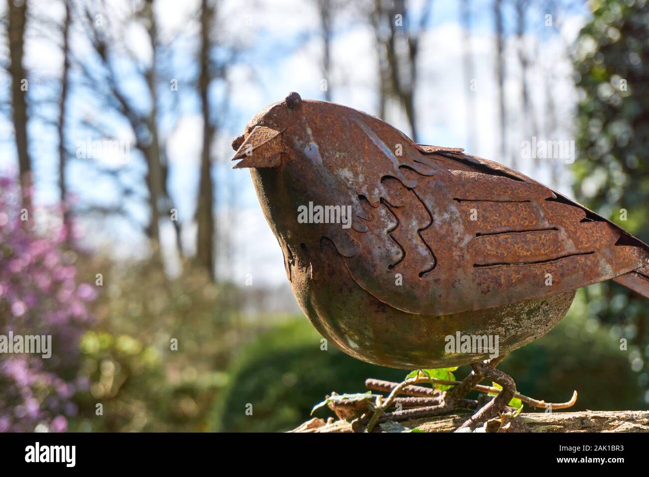 Red Brown Rusted Metal Garden Decor Crow In A Garden In Springtime Stock Photo Alamy