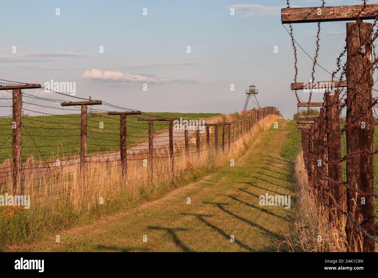 Preserved Iron Curtain Line - barbed wire fence and watchtower on the border of the Czech Republic, from the Cold War era Stock Photo