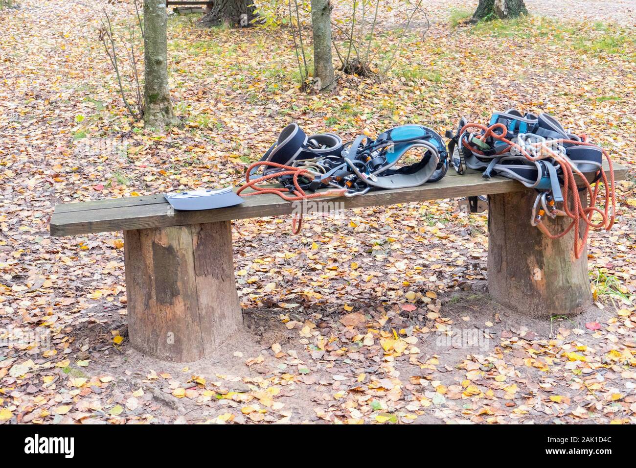 climbing harnesses with safety ropes, aluminum carabiners, loops and braces outdoors. climbing