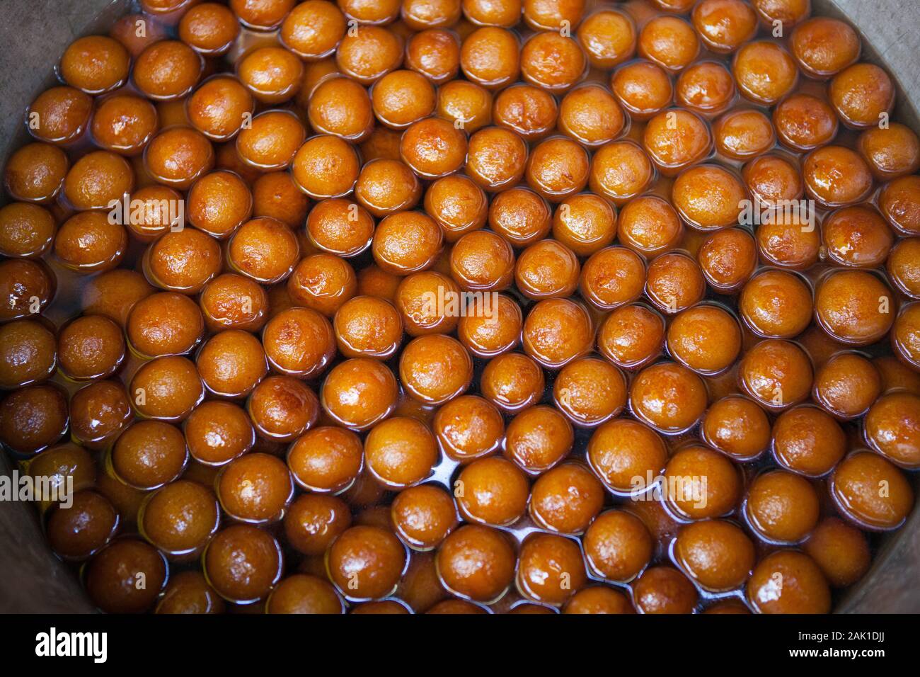 Display of gulab jamun (indian sweets) in the old city of Delhi, India Stock Photo