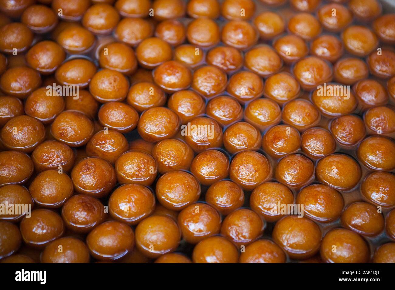 Display of gulab jamun (indian sweets) in the old city of Delhi, India Stock Photo